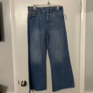 Kid’s medium wash, wide-leg, ankle frayed blue jeans.
